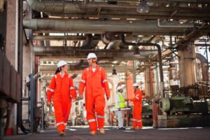 Oil and gas workers wearing full PPE during drilling operations