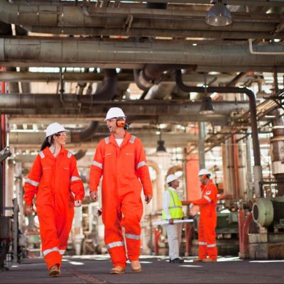 Oil and gas workers wearing full PPE during drilling operations